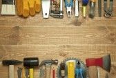  photo 10628538-different-tools-on-a-wooden-background.jpg