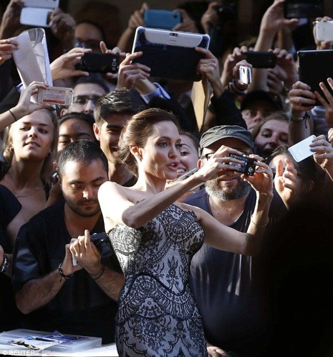 photo 1416256152722_Image_galleryImage_Angelina_Jolie_takes_a_se_zps0eee147a.jpg