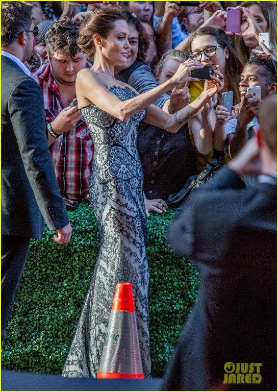 photo angelina-jolie-gets-support-from-hubby-brad-pitt-at-unbroken-04_zps2771a9f3.jpg