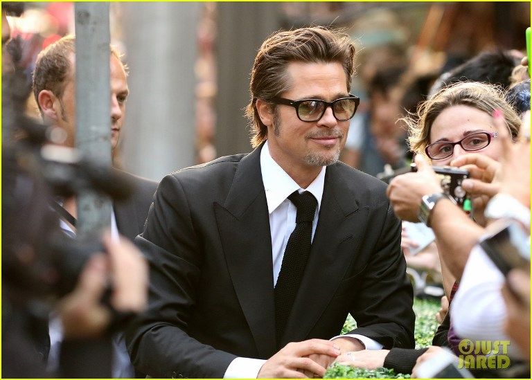 photo angelina-jolie-gets-support-from-hubby-brad-pitt-at-unbroken-11_zps05d41a89.jpg